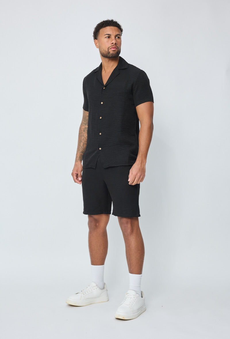 Ensemble Rio noir de la marque NO LIMIT, vêtement élégant pour femme, en tissu noir avec détails modernes.
