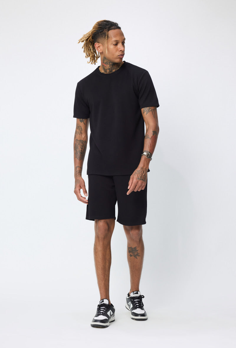 Ensemble basic noir NO LIMIT, vêtements décontractés pour homme, featuring un haut et un pantalon en tissu confortable.