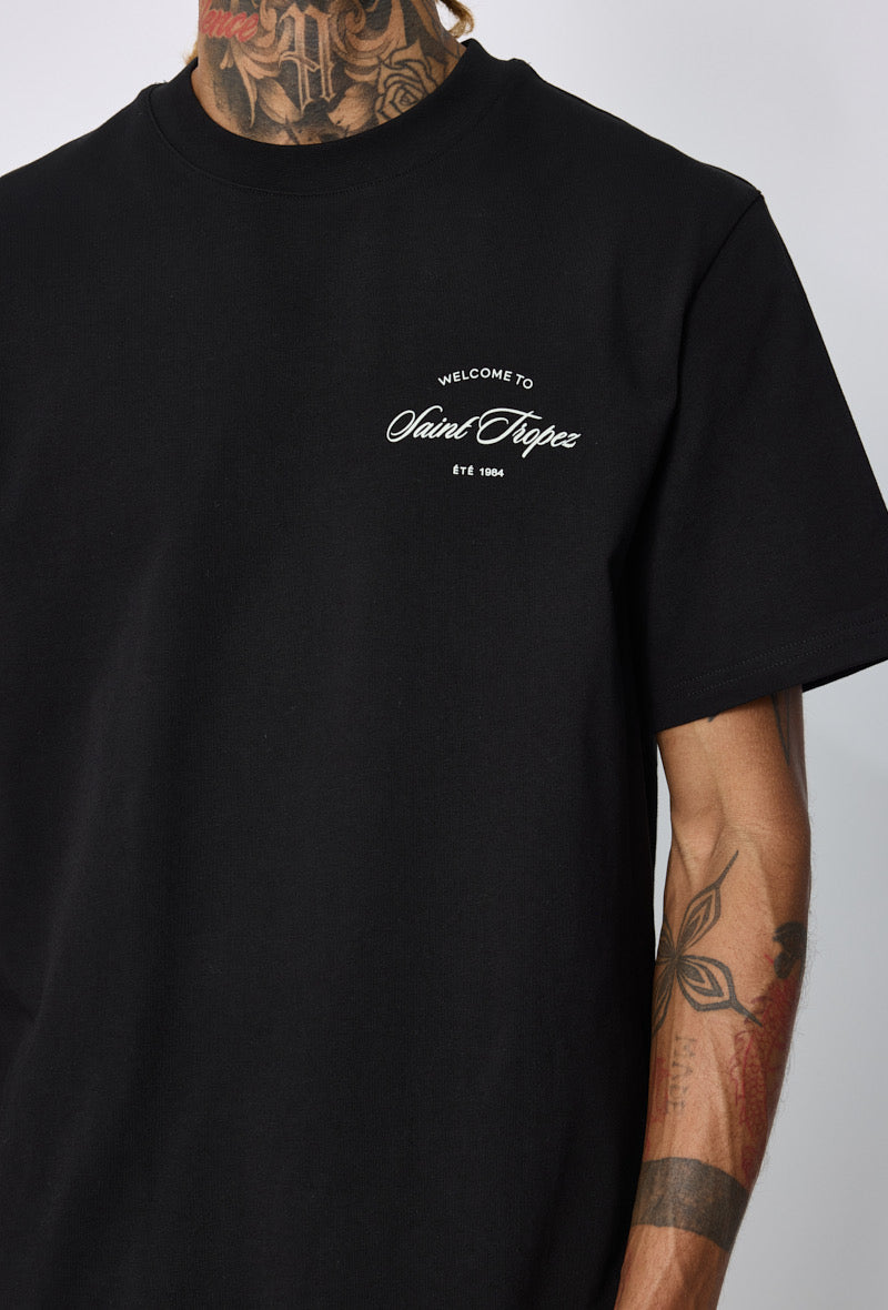 T-shirt noir Saint Tropez de la marque NO LIMIT, tissu uni avec logo discret, porté sur mannequin.