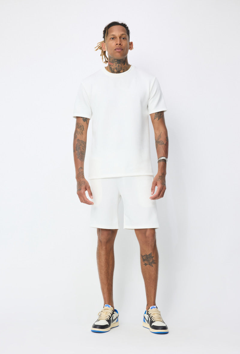 Ensemble basic blanc de la marque NO LIMIT, composé d'un haut et d'un pantalon en coton confortable.