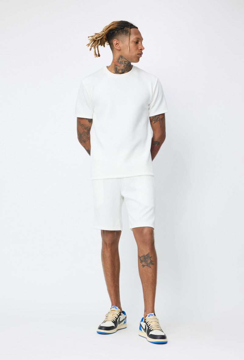 Ensemble basic blanc NO LIMIT, vêtement décontracté pour femmes, vue de l'ensemble posé sur fond blanc.