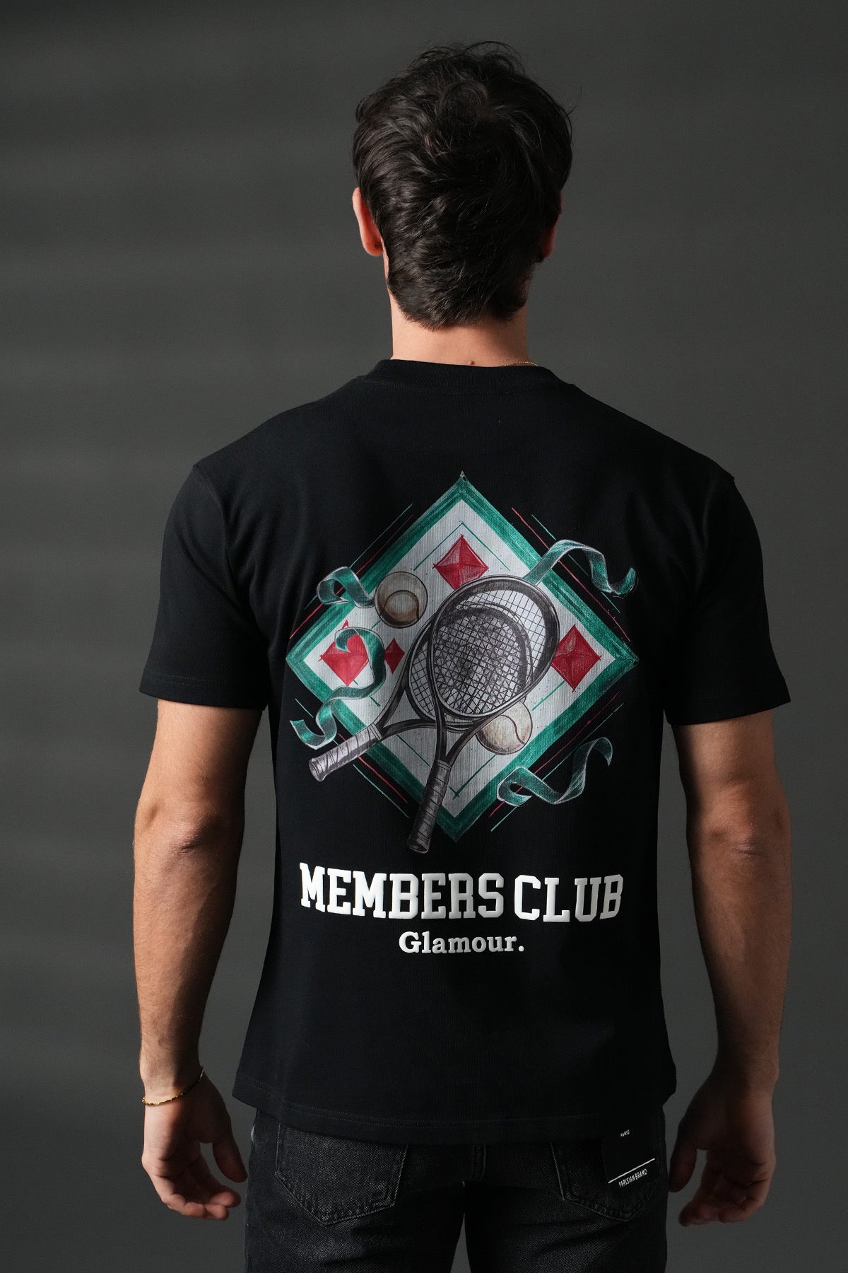 T-shirt de tennis noir NO LIMIT, vêtement sportif léger avec logo visible, idéal pour la pratique du tennis.