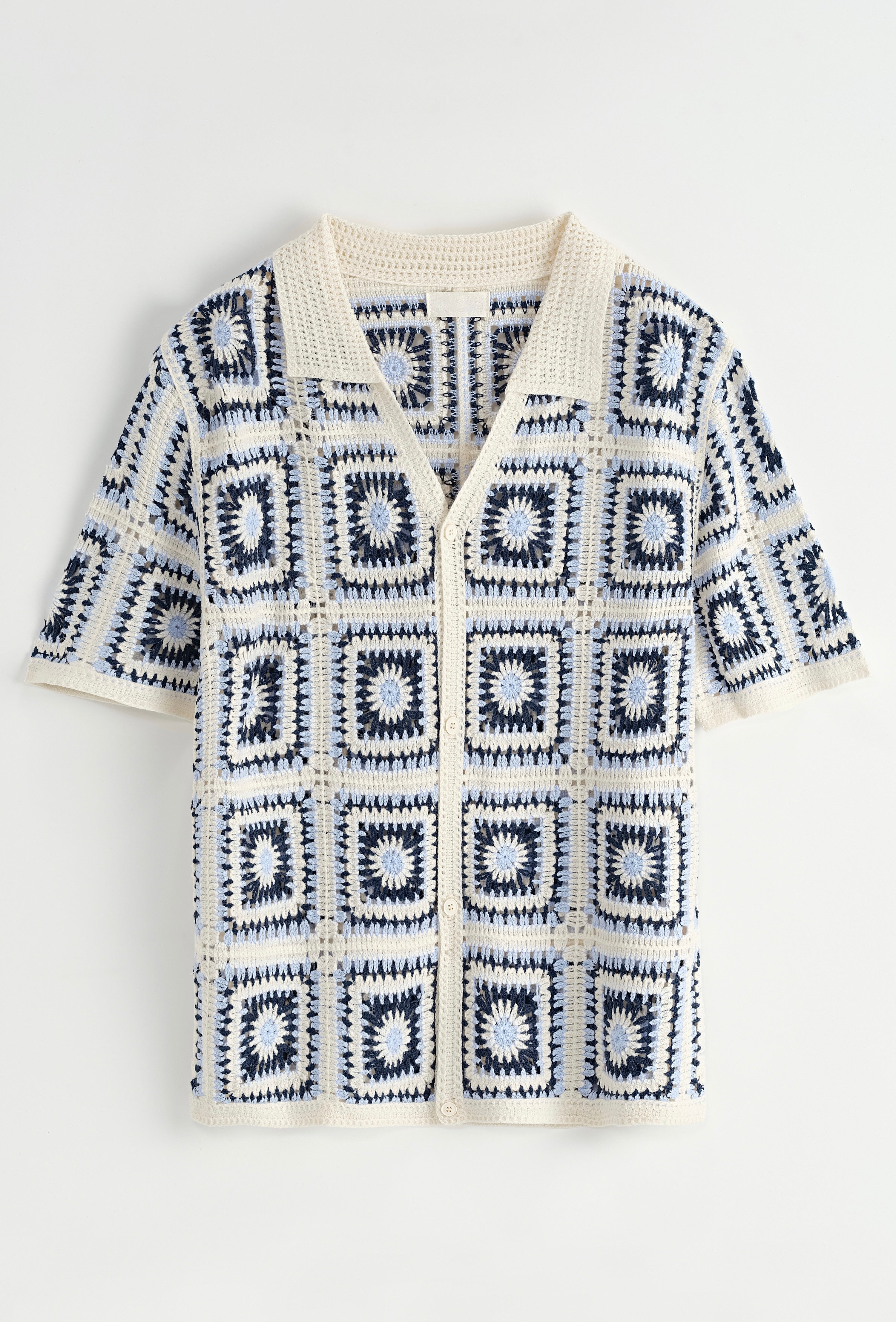 Chemise ajourée NO LIMIT en tissu carré bleu, détails de la maille et coupe élégante visible sur l'image.
