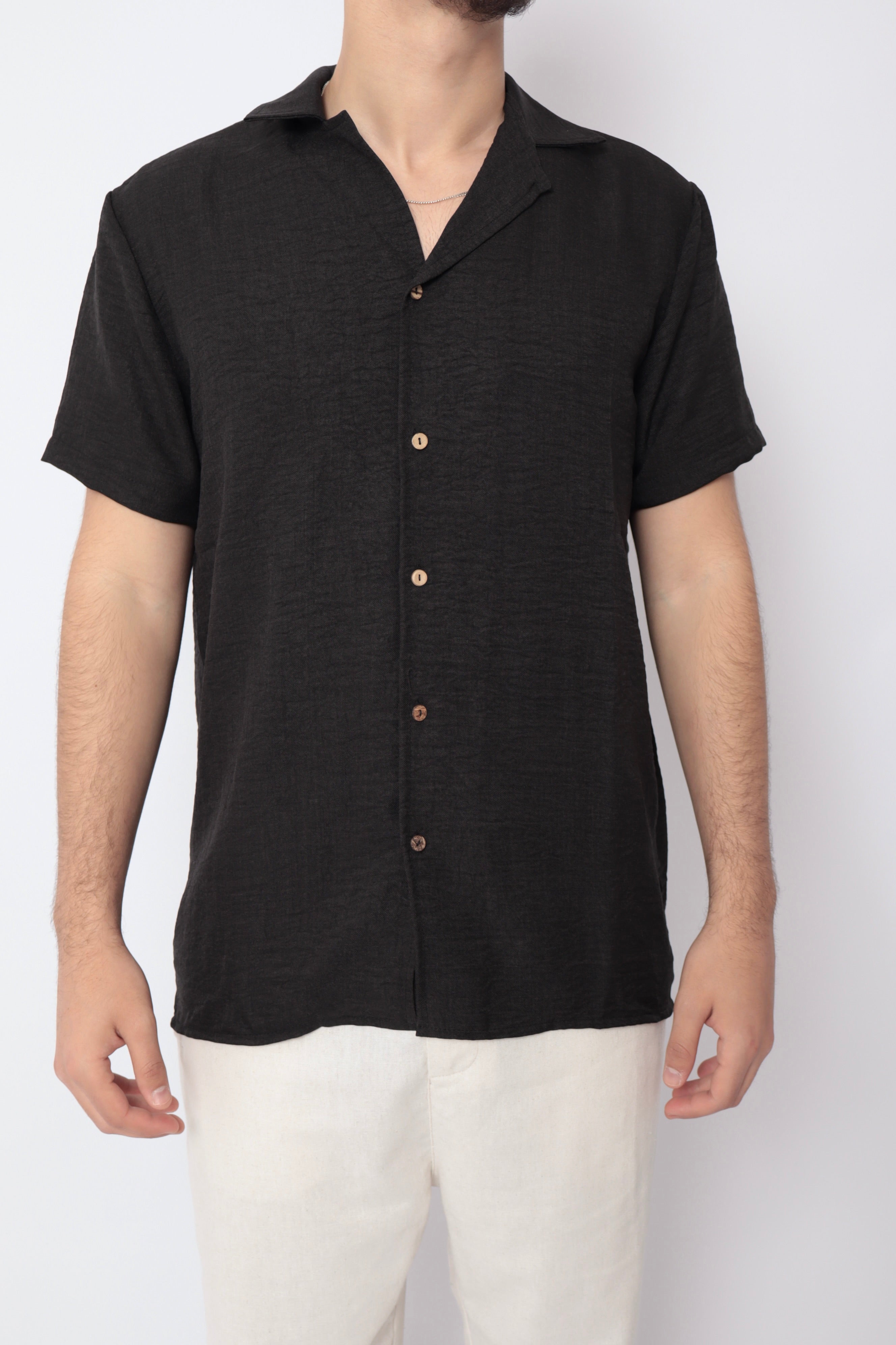 Chemise légère noire de la marque NO LIMIT, vue de face, en tissu fluide avec col classique et manches longues.