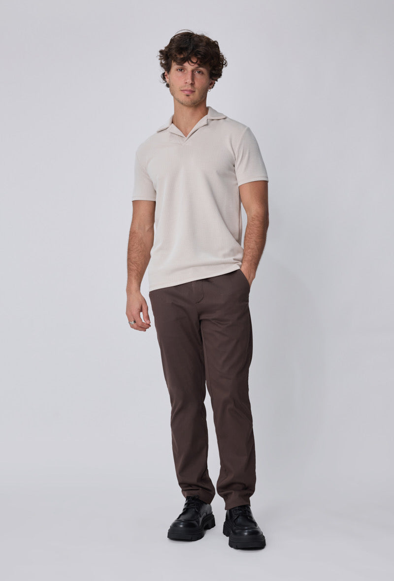 Polo côtelé beige à manches courtes de la marque NO LIMIT, affichant un col classique et une coupe ajustée.