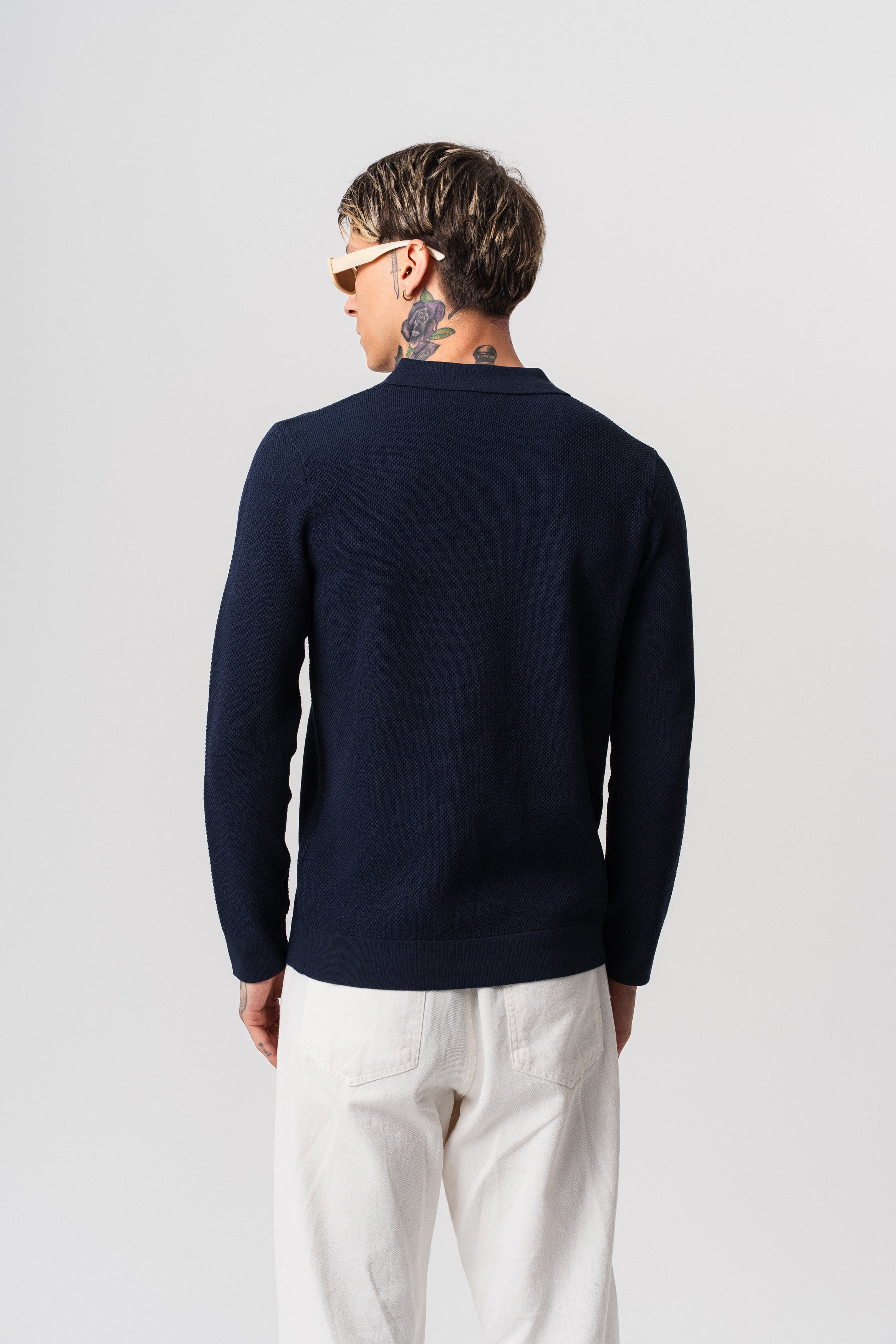 Polo alvéolé à boutons bleu marine pour homme de marque NO LIMIT, manches longues, tissu textured visible sur l'image.