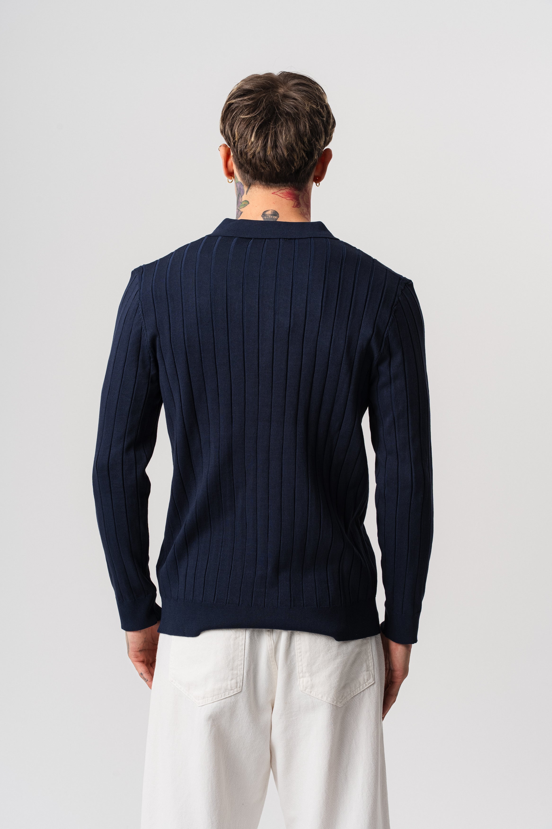 Pull polo en coton côtelé à zip NO LIMIT, manches longues bleu marine, détail de la fermeture éclair visible.