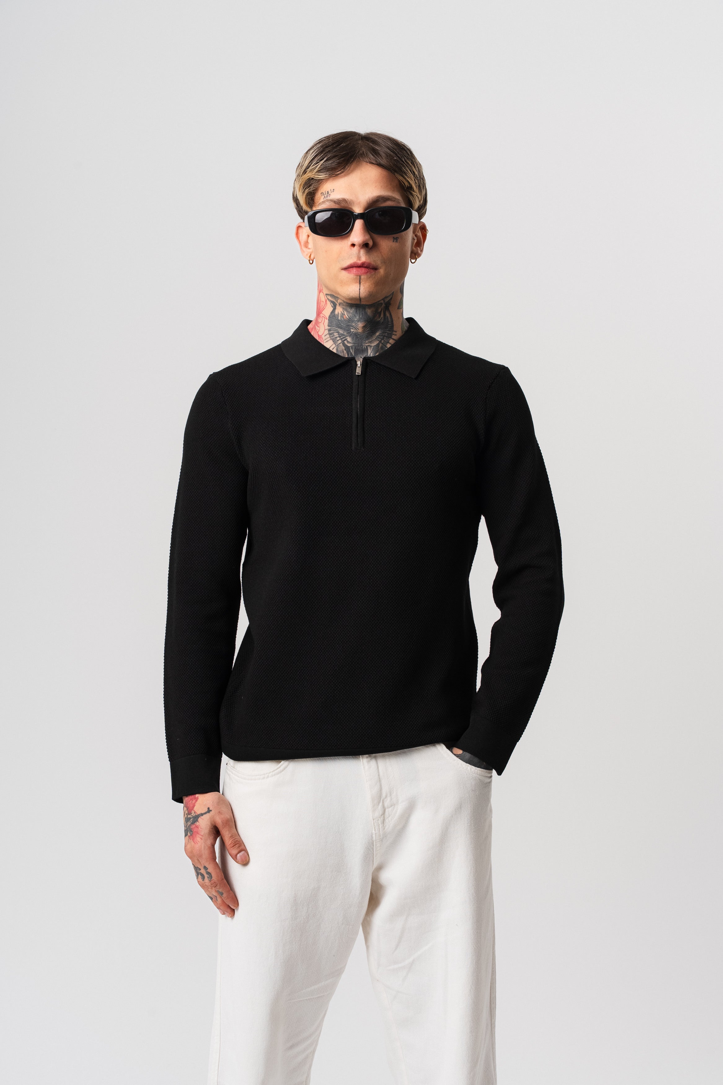 Polo noir texturé à zip à manches longues de la marque NO LIMIT, vue de face sur fond neutre.
