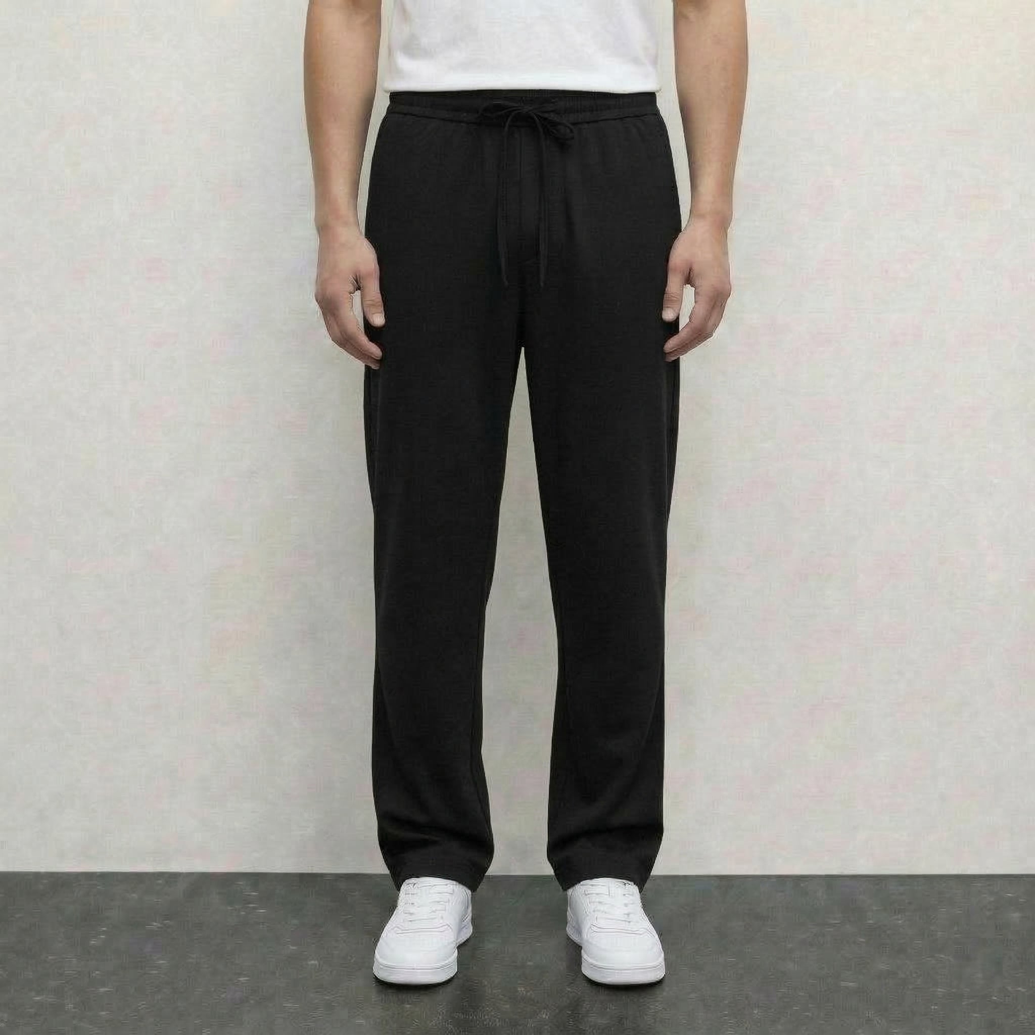 Pantalon noir NO LIMIT, style moderne, tissu léger, ajusté à la taille avec ceinture, vue de face.