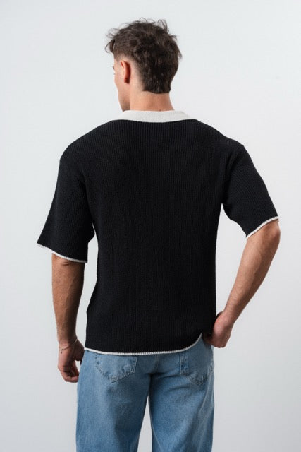 Polo en maille noir pour homme de la marque NO LIMIT, manches courtes, vue de face sur fond blanc.