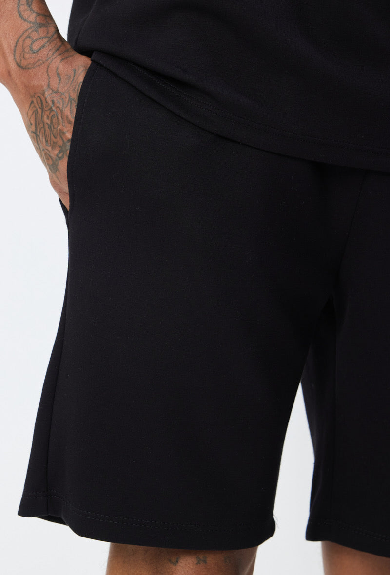 Ensemble noir basique de la marque NO LIMIT, vêtement simple et élégant pour un look décontracté.