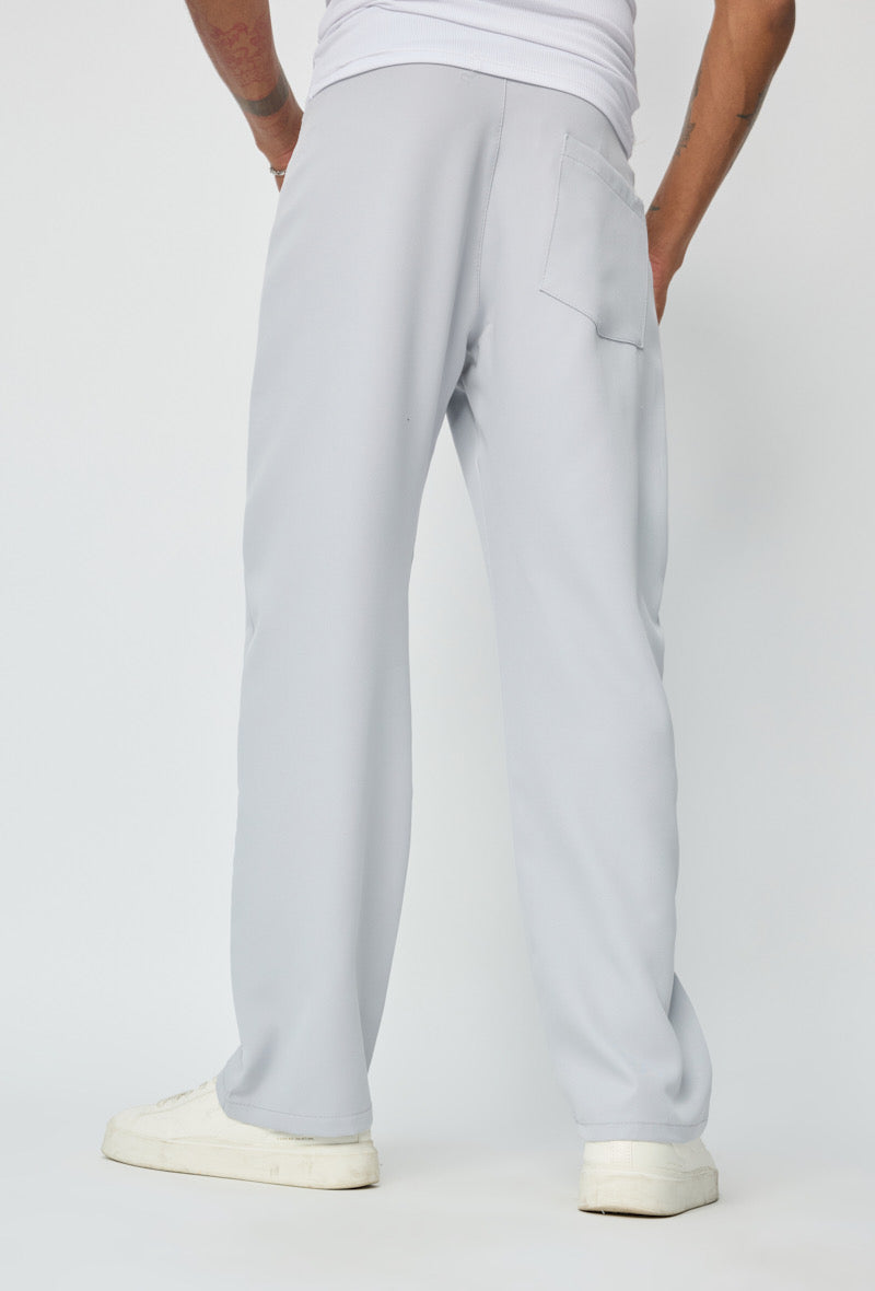 Pantalon fluide gris de la marque NO LIMIT, vue de face, détails du tissu léger et coupe confortable.