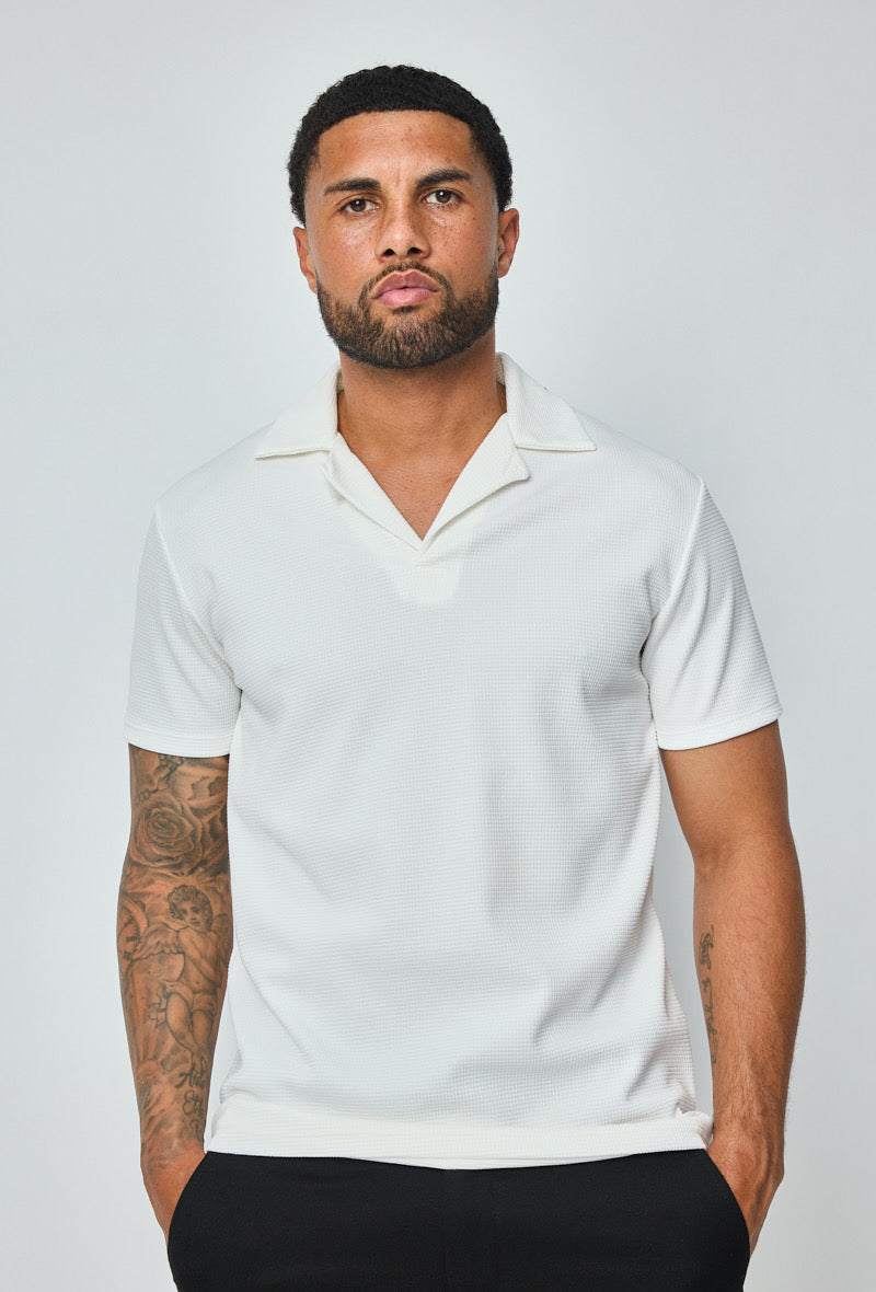 Polo homme blanc à texture, manches courtes, marque NO LIMIT, vue de face sur fond neutre.