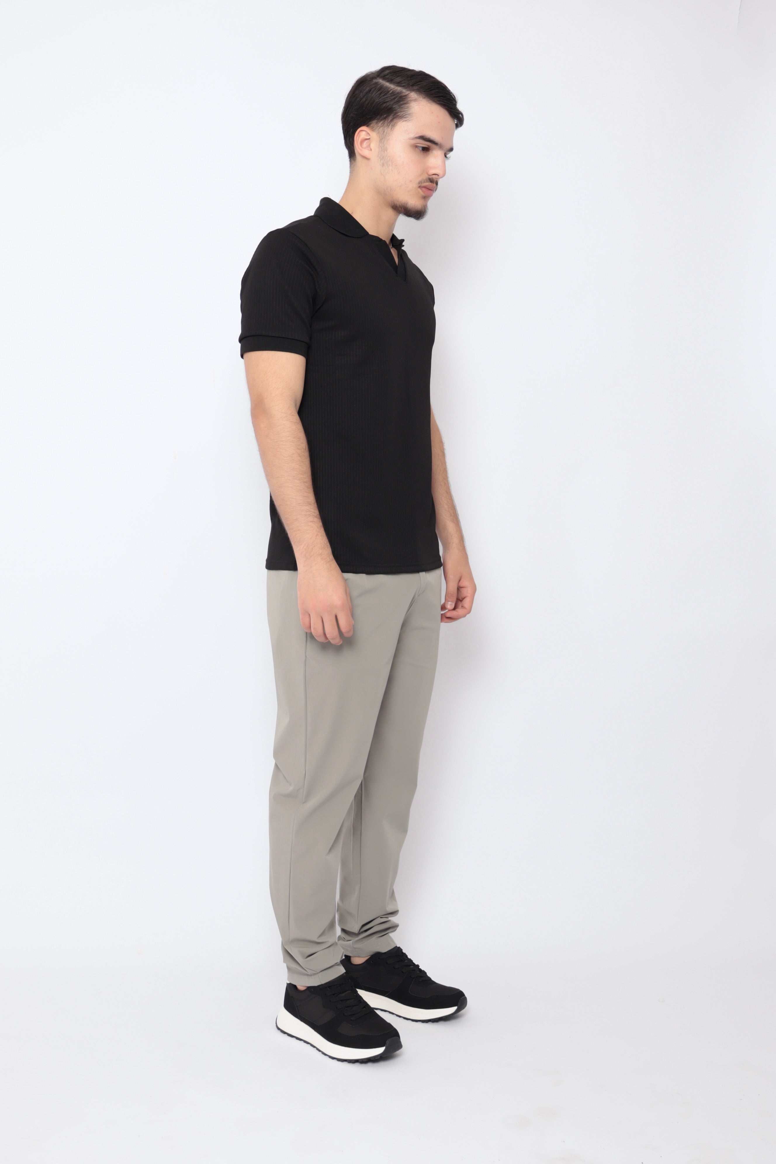Polo à reliefs noir pour homme de marque NO LIMIT avec manches courtes, vue de l'avant, détail texturé.