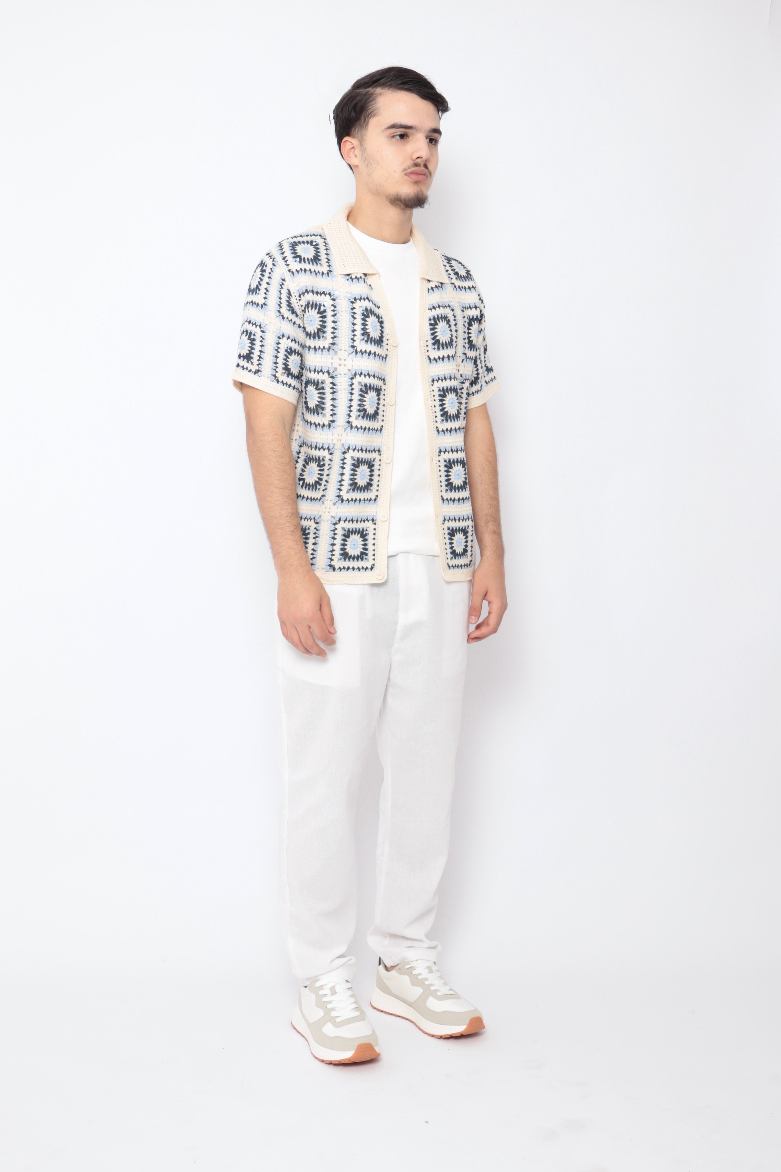 Chemise ajourée NO LIMIT en tissu carré bleu, détails de la maille et coupe élégante visible sur l'image.