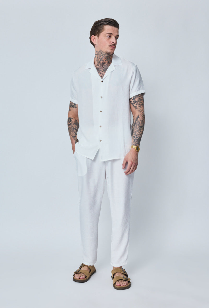 Chemise légère blanche NO LIMIT avec col et manches longues, vue de face sur fond neutre.