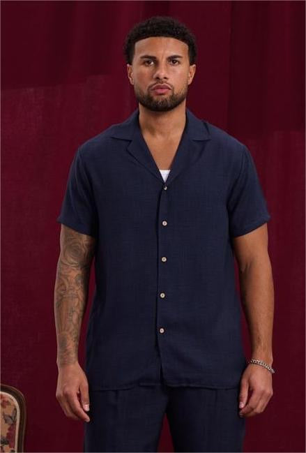 Chemise légère bleue marine de la marque NO LIMIT, tissu fluide et design classique, portée sur mannequin.