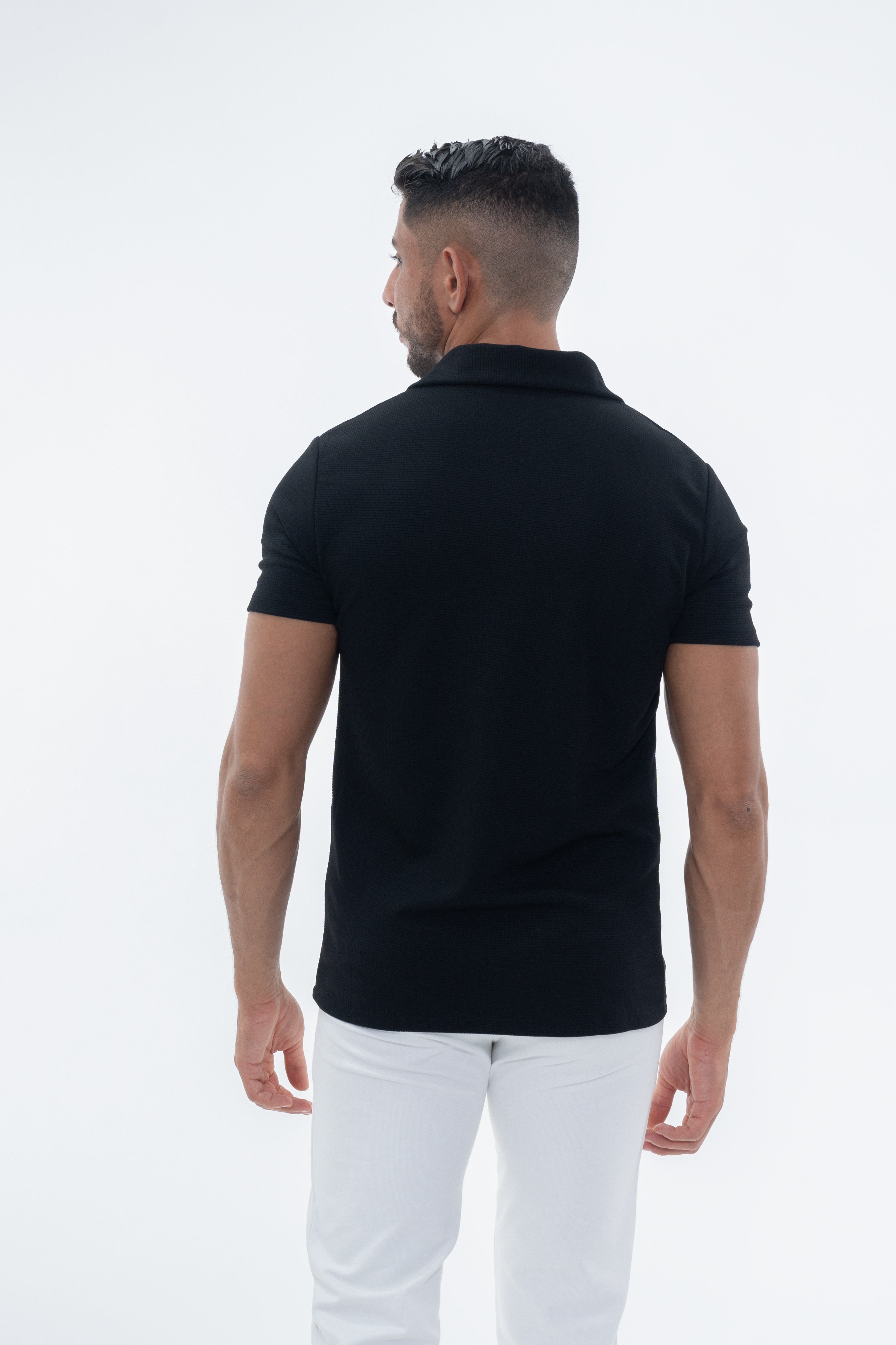 Polo texturé noir pour homme de marque NO LIMIT avec manches courtes, tissu à motif texturé visible.