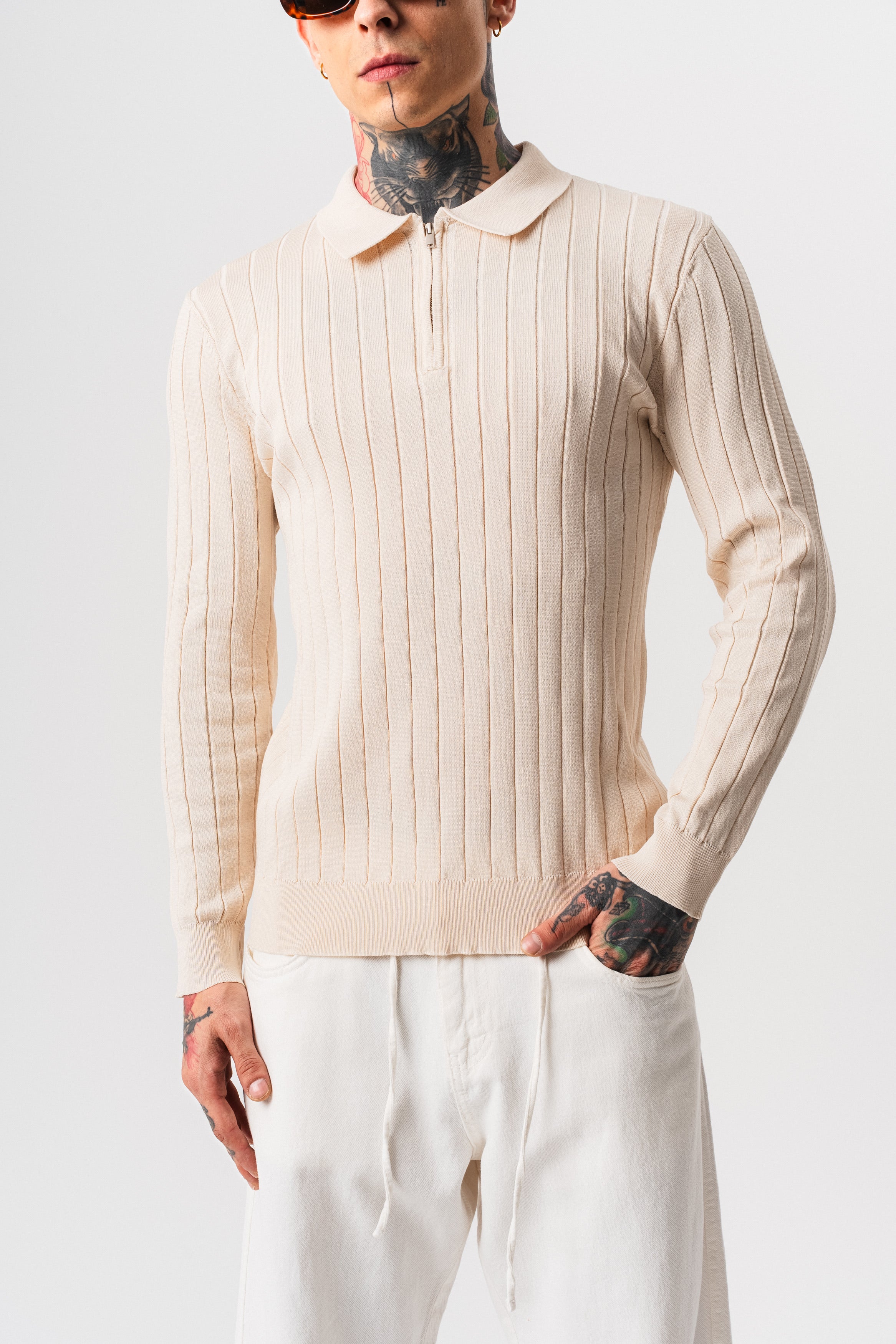 Polo en coton côtelé beige à manches longues de la marque NO LIMIT, avec fermeture à zip visible sur l'image.