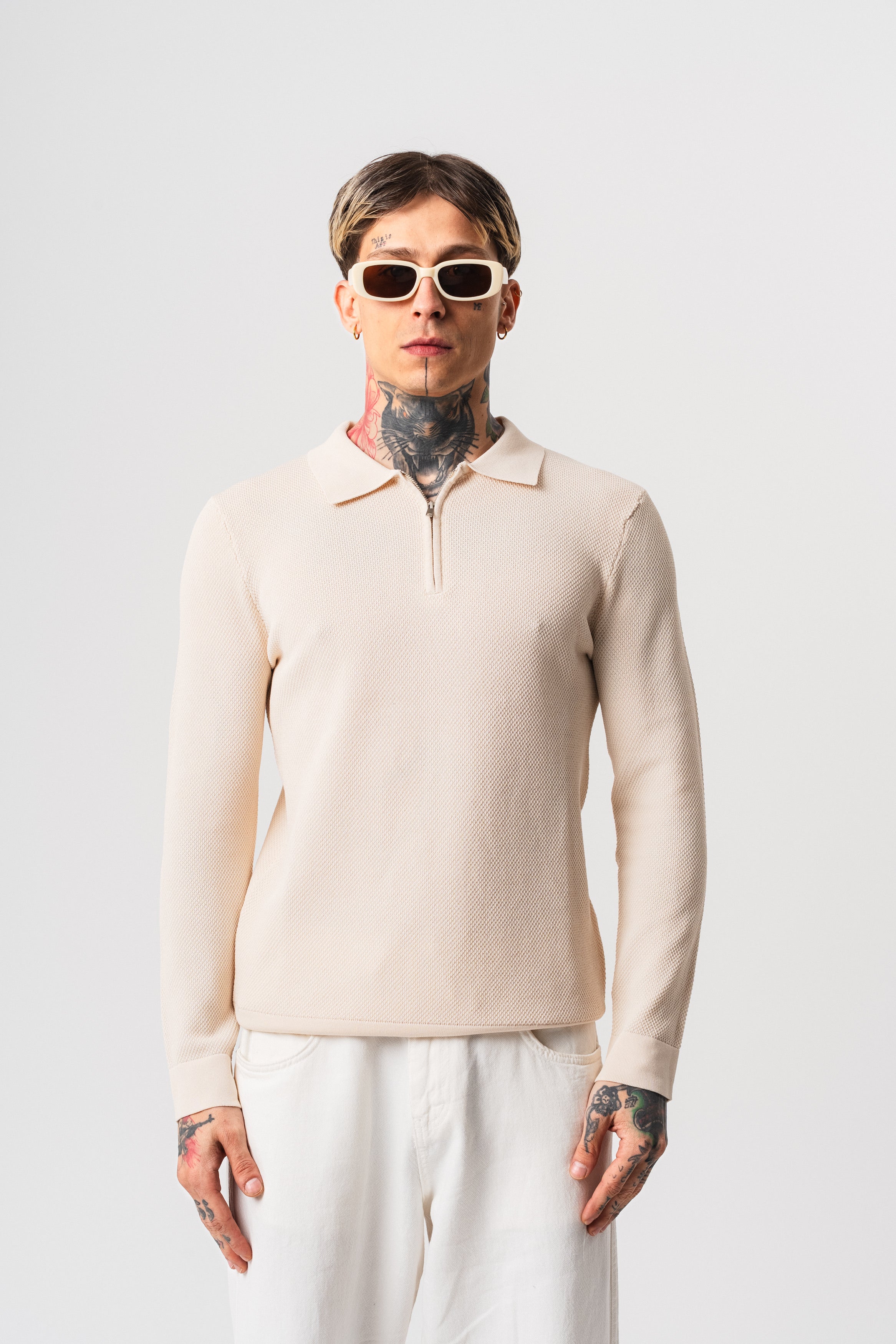 Polo texturé beige à manches longues de la marque NO LIMIT avec fermeture éclair frontale.