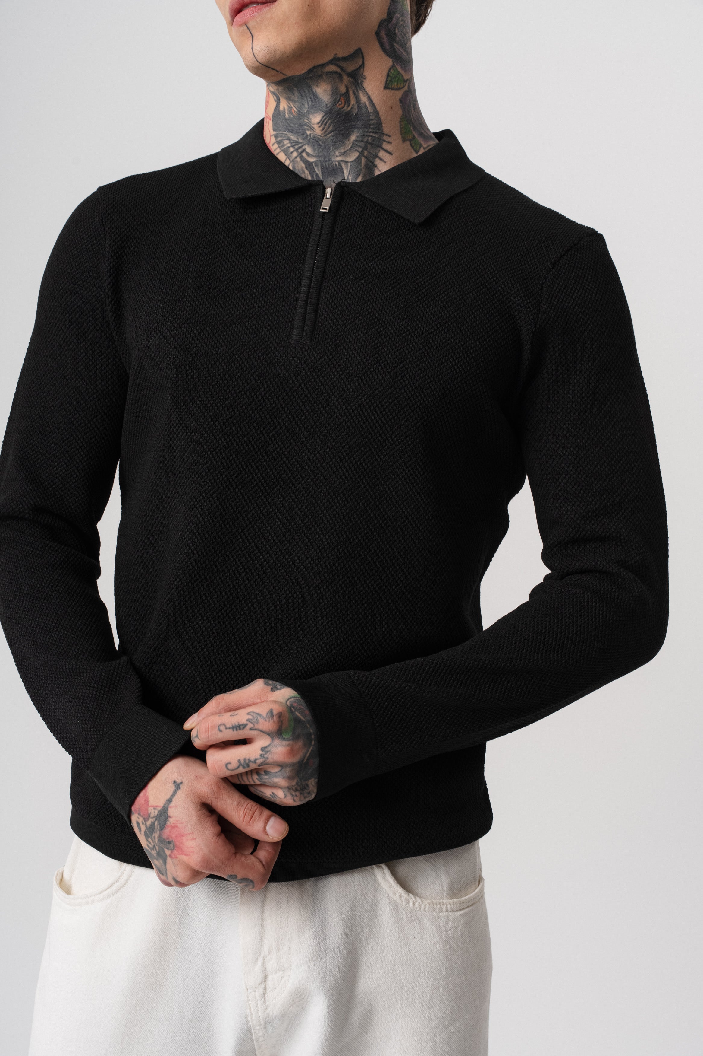 Polo texturé à zip noir pour homme de marque NO LIMIT, manches longues, détail de fermeture éclair visible.