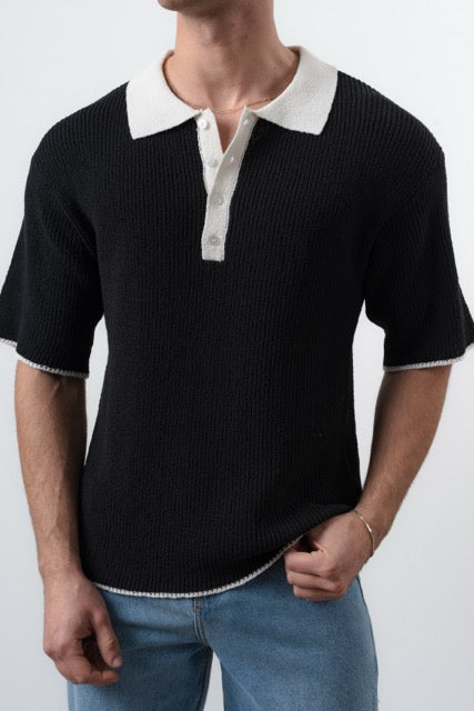 Polo en maille noir à manches courtes de la marque NO LIMIT, vue de face, détails du tissu et col visible.