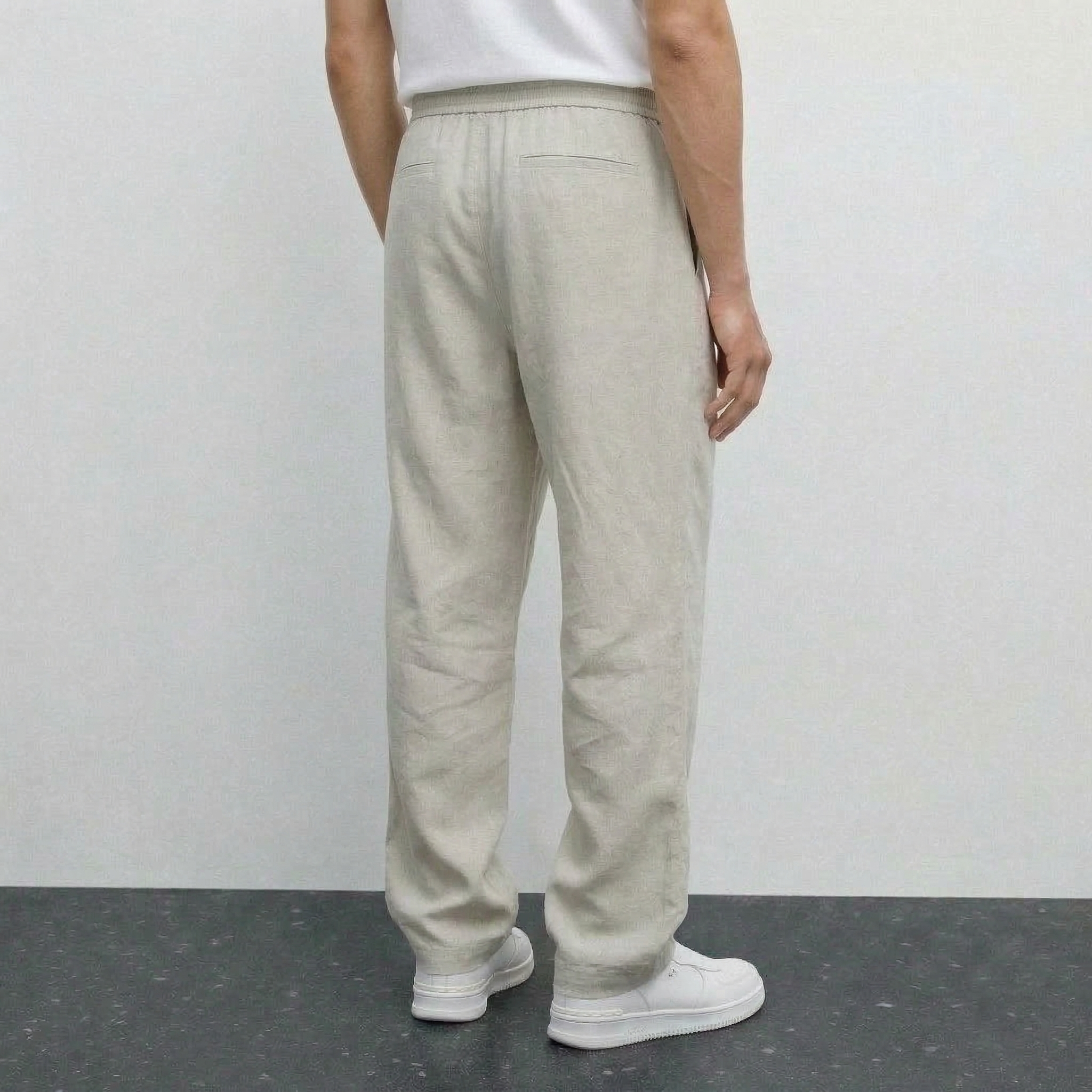 Pantalon beige NO LIMIT pour hommes, coupe classique avec poches, visible sur un fond neutre.