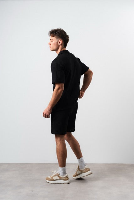 Ensemble maille gaufrée noir de la marque NO LIMIT, comprenant un haut et un bas en tissu côtelé.